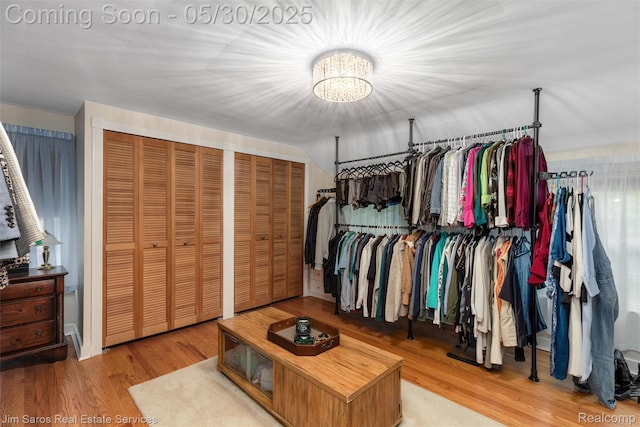 441 Mckinley Ave, Grosse Pointe Farms, MI 48236 - spacious closet with a chandelier and wood finished floors
