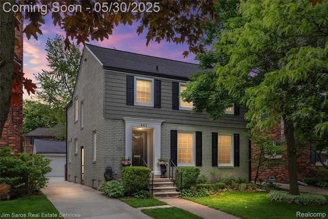 441 Mckinley Ave, Grosse Pointe Farms, MI 48236 - view of front of home featuring an outdoor structure, brick siding, and a front lawn