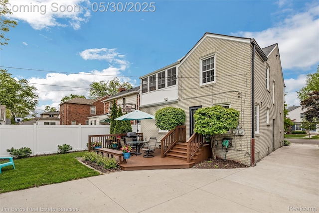 441 Mckinley Ave, Grosse Pointe Farms, MI 48236 - view of front facade with a wooden deck and outdoor dining area