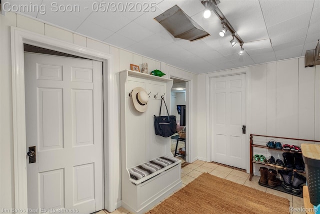 441 Mckinley Ave, Grosse Pointe Farms, MI 48236 - mudroom featuring light tile patterned floors, track lighting, and a decorative wall