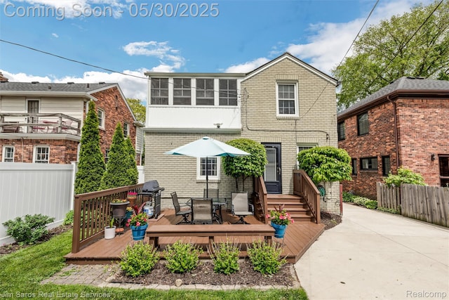 441 Mckinley Ave, Grosse Pointe Farms, MI 48236 - back of house featuring a deck, brick siding, and outdoor dining area