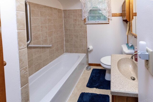 1202 Avalon Ave, Saginaw, MI 48638 - full bathroom featuring toilet, tile patterned flooring, vanity, baseboards, and bathtub / shower combination
