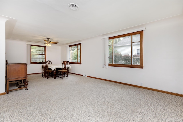 1202 Avalon Ave, Saginaw, MI 48638 - dining space featuring carpet, baseboards, and a ceiling fan