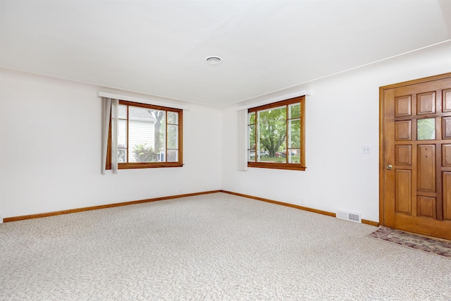 1202 Avalon Ave, Saginaw, MI 48638 - carpeted spare room featuring baseboards