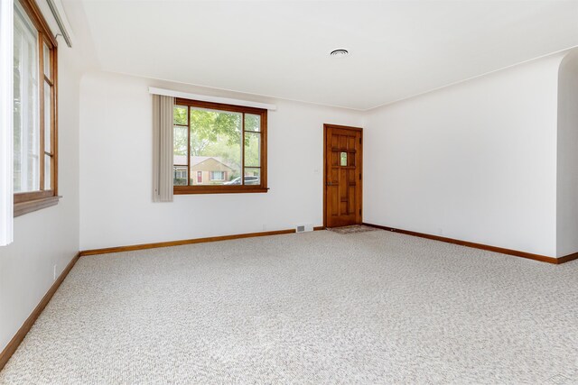 1202 Avalon Ave, Saginaw, MI 48638 - carpeted empty room with baseboards