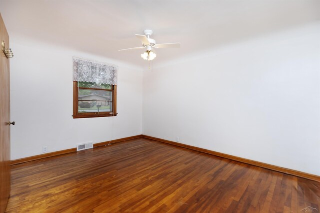 1202 Avalon Ave, Saginaw, MI 48638 - unfurnished room with wood finished floors, baseboards, and ceiling fan
