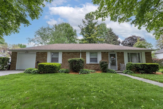 1202 Avalon Ave, Saginaw, MI 48638 - ranch-style home with brick siding, an attached garage, a front lawn, and driveway