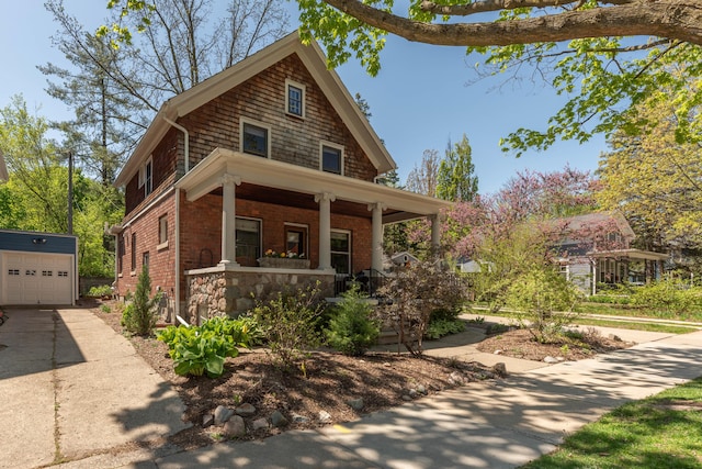 511 W Jefferson St, Ann Arbor, MI 48103 - view of front of property with a porch, an outbuilding, and driveway