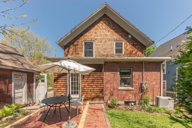 511 W Jefferson St, Ann Arbor, MI 48103 - back of property featuring a patio and central AC