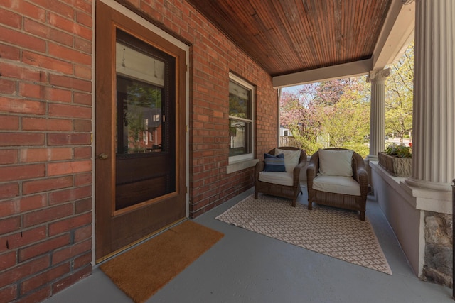 511 W Jefferson St, Ann Arbor, MI 48103 - doorway to property with covered porch and brick siding