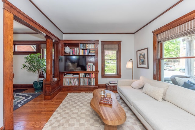 511 W Jefferson St, Ann Arbor, MI 48103 - living area featuring wood finished floors, plenty of natural light, crown molding, and baseboards