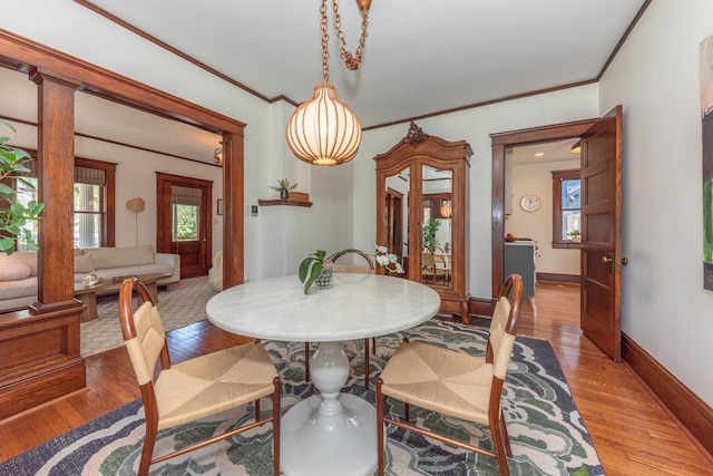 511 W Jefferson St, Ann Arbor, MI 48103 - dining room featuring ornamental molding, wood finished floors, and baseboards