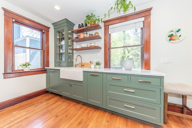 511 W Jefferson St, Ann Arbor, MI 48103 - bar area with a sink, plenty of natural light, baseboards, light wood finished floors, and recessed lighting
