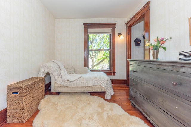 511 W Jefferson St, Ann Arbor, MI 48103 - bedroom with wood finished floors, wallpapered walls, and baseboards