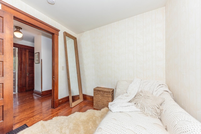 511 W Jefferson St, Ann Arbor, MI 48103 - bedroom with wood finished floors, baseboards, and wallpapered walls