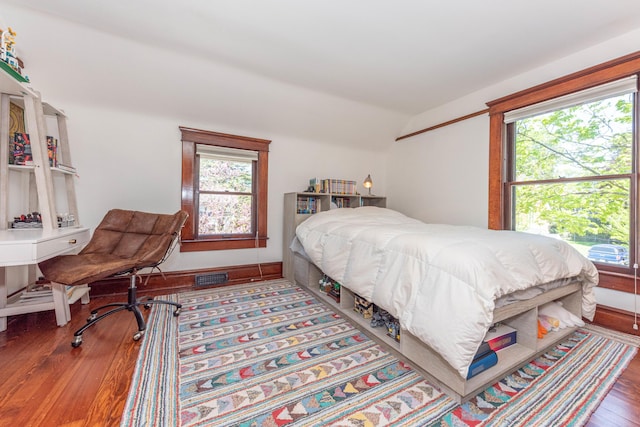 511 W Jefferson St, Ann Arbor, MI 48103 - bedroom featuring lofted ceiling, wood finished floors, multiple windows, and baseboards