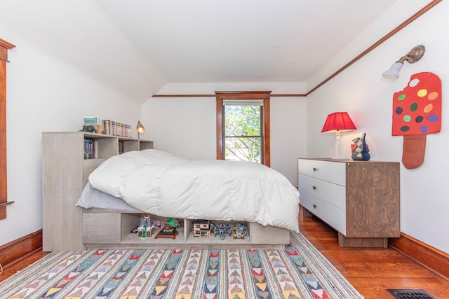 511 W Jefferson St, Ann Arbor, MI 48103 - bedroom featuring wood finished floors, vaulted ceiling, and baseboards
