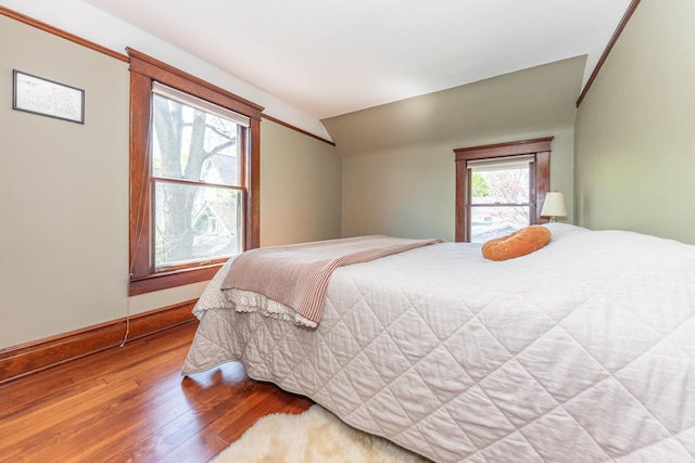 511 W Jefferson St, Ann Arbor, MI 48103 - bedroom with hardwood / wood-style floors, lofted ceiling, and baseboards