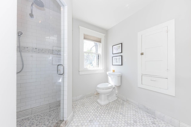 511 W Jefferson St, Ann Arbor, MI 48103 - full bathroom with a stall shower, toilet, and baseboards