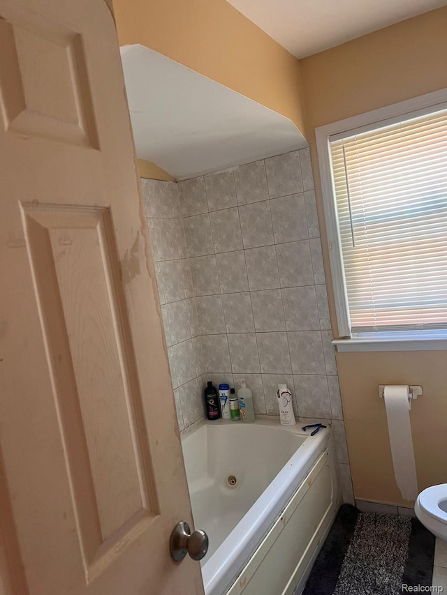9910 Coyle St, Detroit, MI 48227 - full bathroom featuring toilet, tile patterned flooring, tile walls, and  shower combination