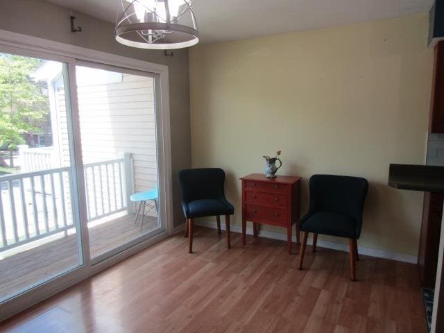 2024 Hamilton St, Okemos, MI 48864 - sitting room with light wood-type flooring, baseboards, and a chandelier