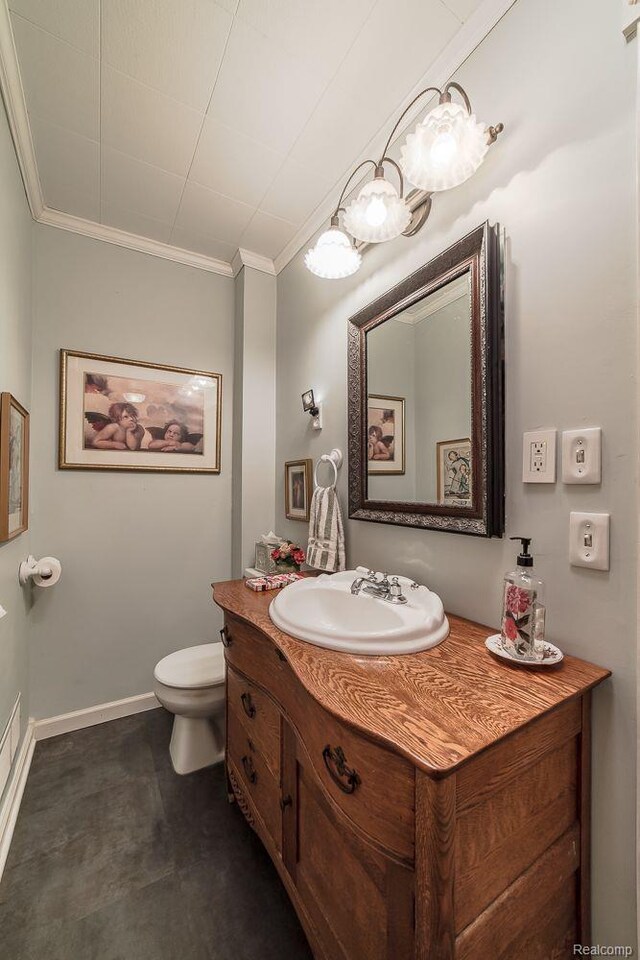 1786 Point St, Commerce Twp, MI 48382 - bathroom featuring ornamental molding, vanity, toilet, and baseboards