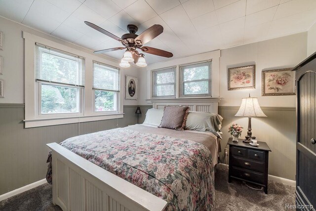 1786 Point St, Commerce Twp, MI 48382 - bedroom featuring wainscoting, carpet, ceiling fan, and wood walls