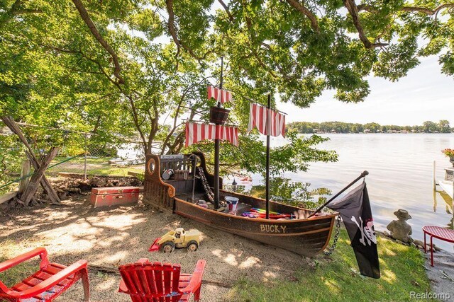 1786 Point St, Commerce Twp, MI 48382 - view of play area with a water view