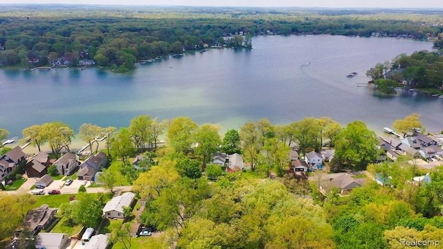 1786 Point St, Commerce Twp, MI 48382 - aerial view of residential area with a nearby body of water and a heavily wooded area