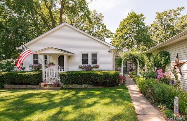 1786 Point St, Commerce Twp, MI 48382 - bungalow-style house with a front lawn