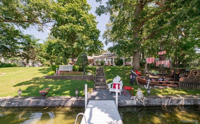 1786 Point St, Commerce Twp, MI 48382 - dock area featuring a lawn