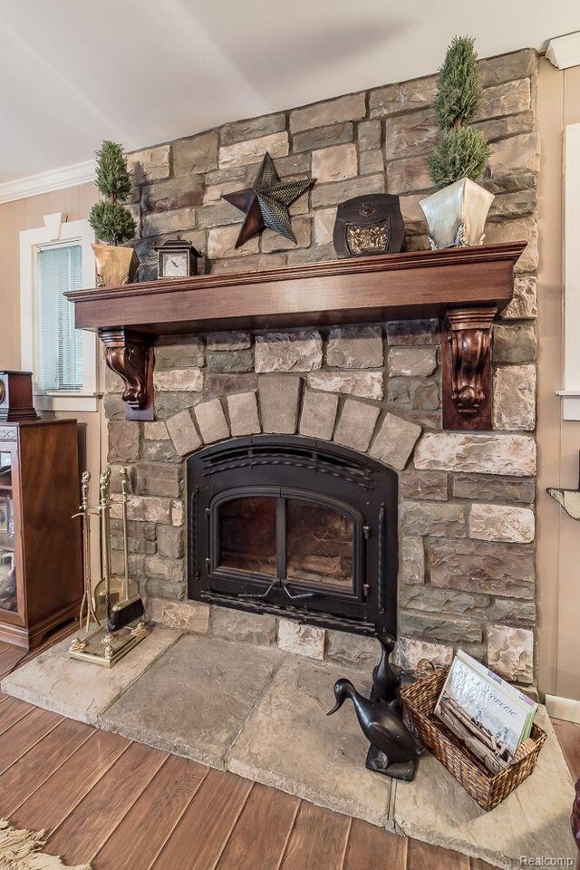 1786 Point St, Commerce Twp, MI 48382 - detailed view of wood finished floors, a fireplace, and ornamental molding