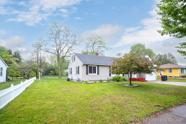 100 E 35th St, Holland, MI 49423 - view of front of property with driveway, a chimney, and a shingled roof