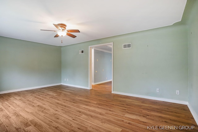 100 E 35th St, Holland, MI 49423 - unfurnished room with a ceiling fan, baseboards, and wood finished floors