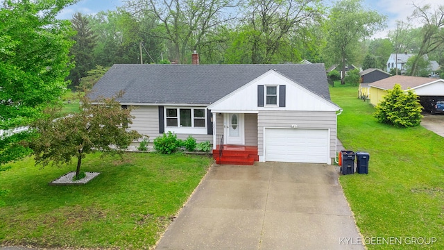 100 E 35th St, Holland, MI 49423 - view of front of house with a chimney, driveway, a front yard, and a shingled roof