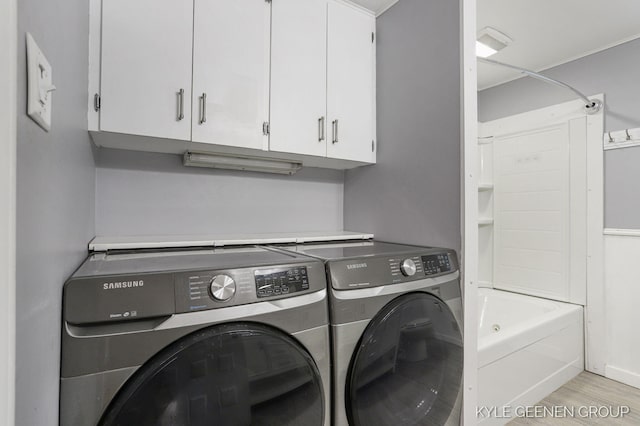 100 E 35th St, Holland, MI 49423 - laundry area with washer and dryer and light wood-style flooring