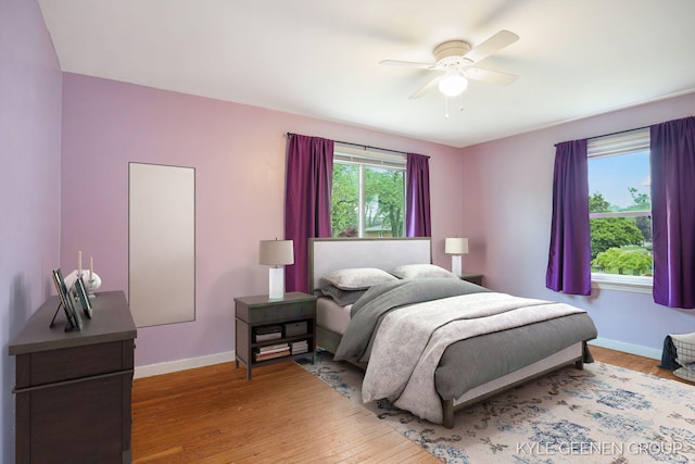 100 E 35th St, Holland, MI 49423 - bedroom with baseboards, wood finished floors, and a ceiling fan