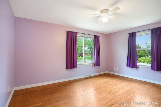 100 E 35th St, Holland, MI 49423 - spare room with hardwood / wood-style floors, baseboards, and a ceiling fan