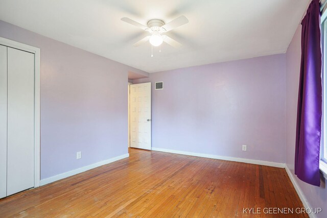 100 E 35th St, Holland, MI 49423 - unfurnished bedroom featuring wood-type flooring, baseboards, a ceiling fan, and a closet