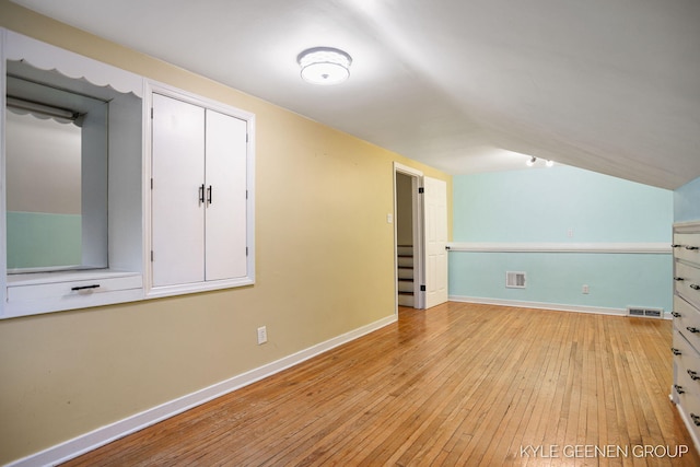 100 E 35th St, Holland, MI 49423 - additional living space with light wood finished floors, baseboards, and vaulted ceiling
