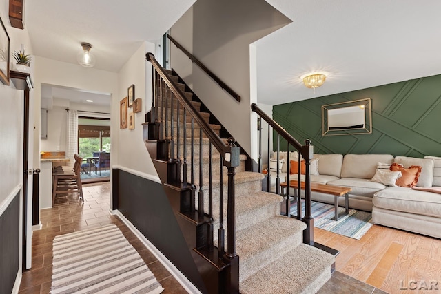 431 Meadowbrook Dr, Adrian, MI 49221 - stairway featuring a decorative wall