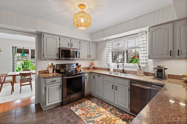 431 Meadowbrook Dr, Adrian, MI 49221 - kitchen with stainless steel appliances, a sink, healthy amount of natural light, and gray cabinetry