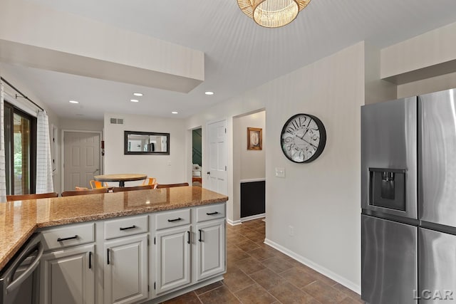 431 Meadowbrook Dr, Adrian, MI 49221 - kitchen with stainless steel fridge with ice dispenser, baseboards, dishwashing machine, white cabinets, and recessed lighting