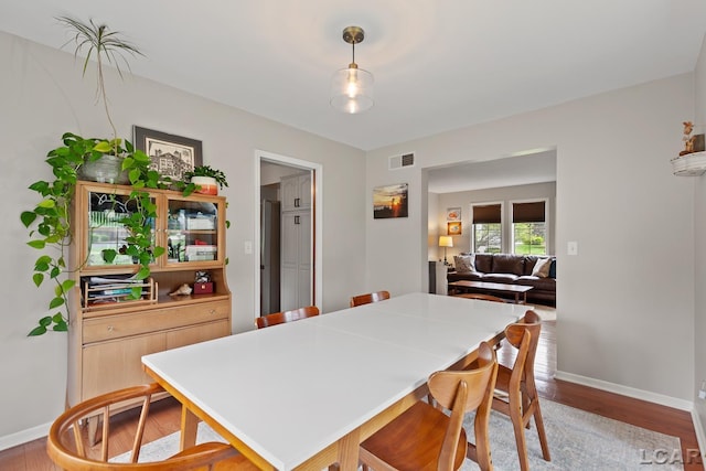 431 Meadowbrook Dr, Adrian, MI 49221 - dining space featuring baseboards and wood finished floors
