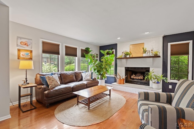 431 Meadowbrook Dr, Adrian, MI 49221 - living room with plenty of natural light, a fireplace, wood finished floors, recessed lighting, and baseboards