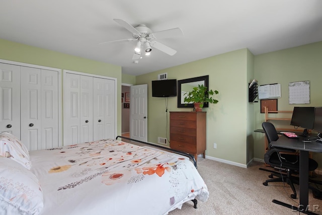 431 Meadowbrook Dr, Adrian, MI 49221 - bedroom featuring multiple closets, a desk, a ceiling fan, light carpet, and baseboards