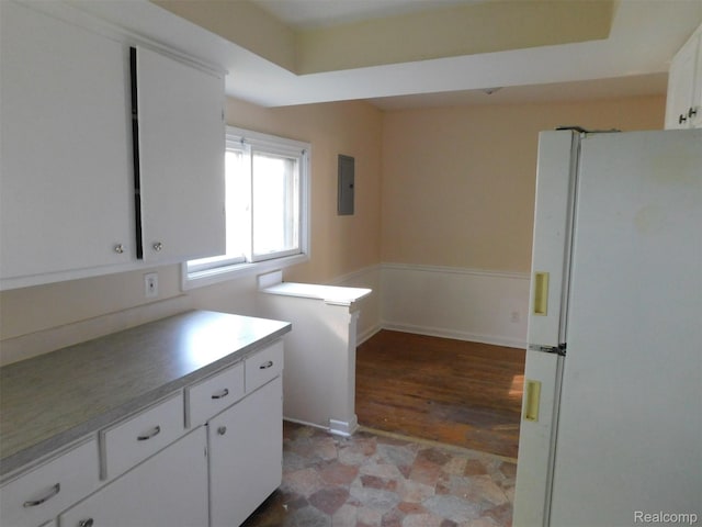 710 Washington St, Algonac, MI 48001 - kitchen with freestanding refrigerator, electric panel, white cabinetry, and light countertops