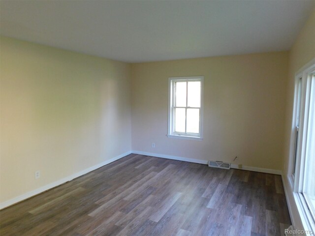 710 Washington St, Algonac, MI 48001 - unfurnished room featuring dark wood-style flooring and baseboards