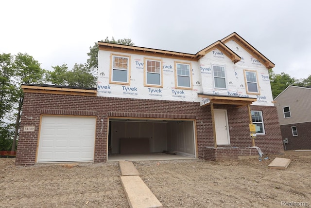 14149 Old Oak Trl, Van Buren, MI 48111 - unfinished property with brick siding, driveway, and a garage