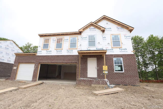 14149 Old Oak Trl, Van Buren, MI 48111 - property under construction featuring brick siding, an attached garage, and dirt driveway